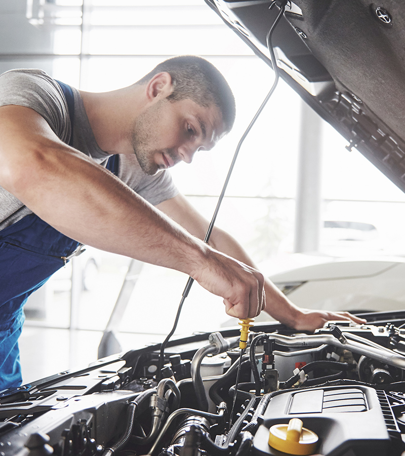 worker-cleaning-automobile-air-conditioner-vent-gr