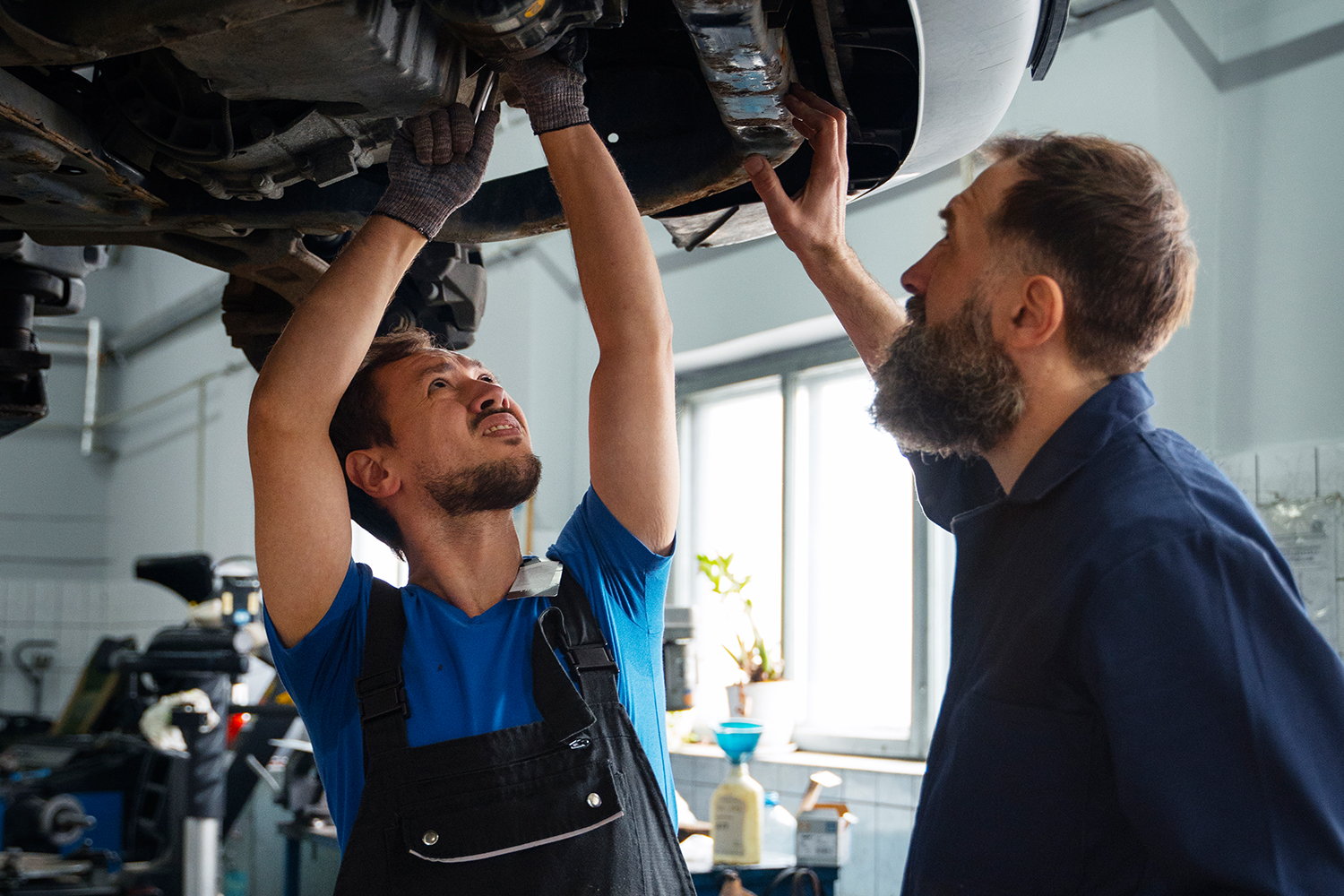 worker-cleaning-modern-vehicle-alloy-wheels