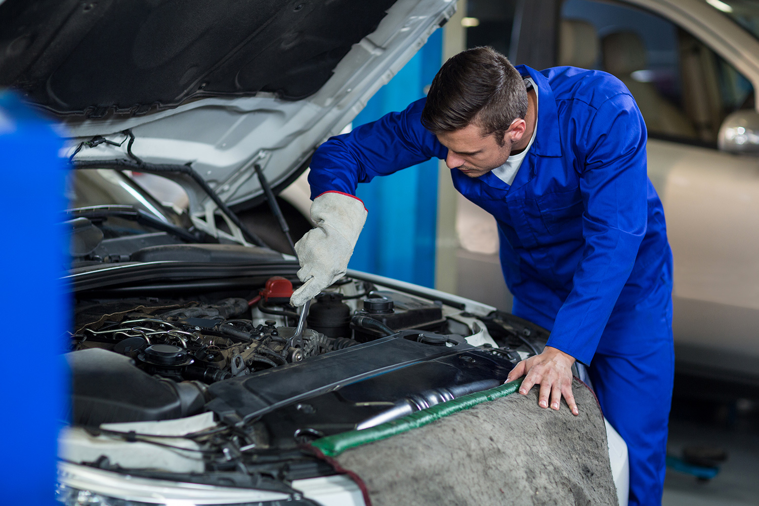 worker-disassembling-car-interior